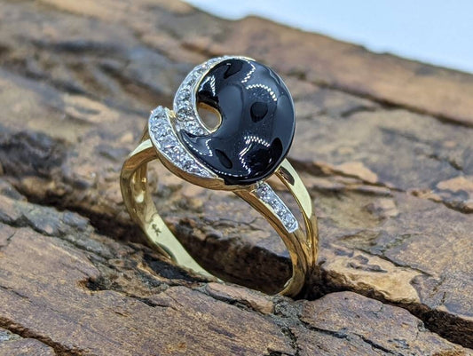 14k Onyx and diamond Band. 14k Curved Oval Disk Onyx and channel set diamond ring. Abstract Onyx ring. st (138/00)