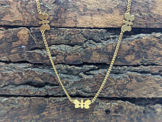14k Butterfly Necklace. Multiple Butterfly pendants on a necklace. Yellow gold curb chain. st77/60