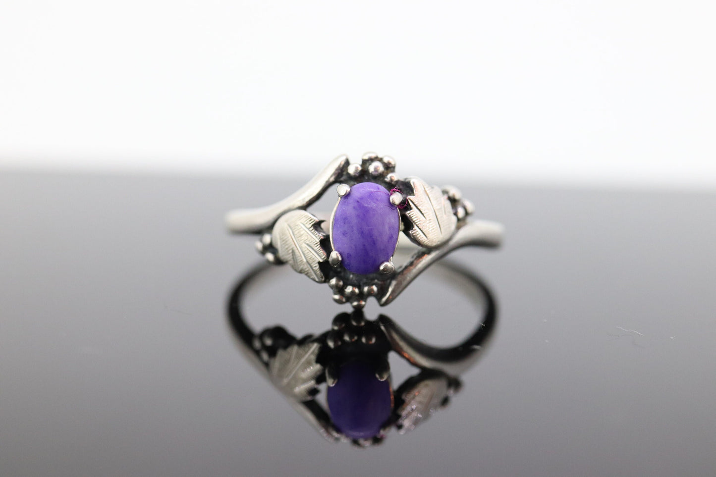 Black Hills Gold Sterling Silver Ring. Purple Sugilite cabochon with 10k inlays band. st(55)