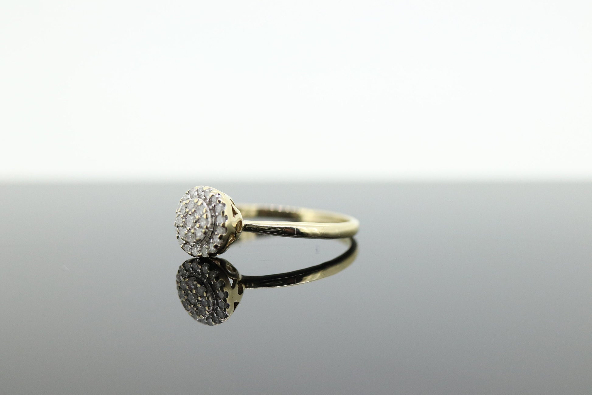 Diamond Daisy Cluster Elevated Ring. 10k Yellow gold with round diamond Cluster arrangement. st(47)