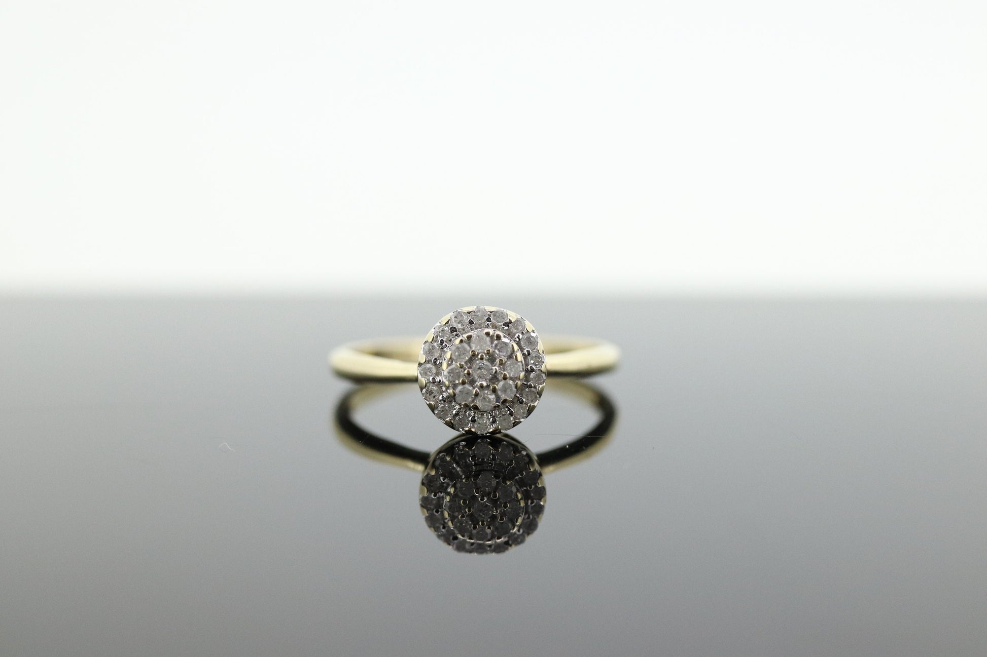 Diamond Daisy Cluster Elevated Ring. 10k Yellow gold with round diamond Cluster arrangement. st(47)