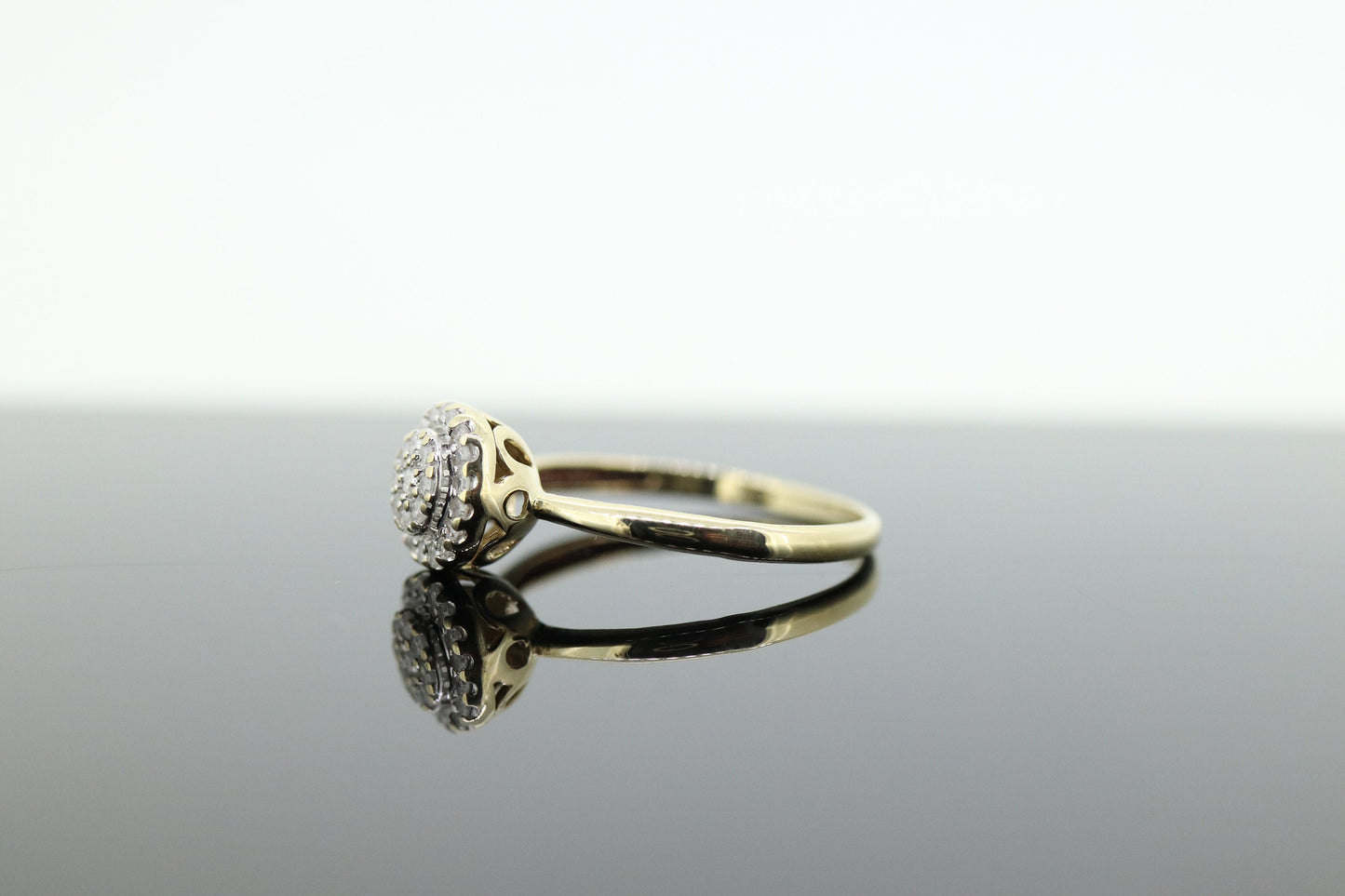 Diamond Daisy Cluster Elevated Ring. 10k Yellow gold with round diamond Cluster arrangement. st(47)