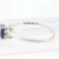 Platinum Sapphire and diamond ring. Oval blue Sapphire solitaire with Diamond accents trilogy ring.