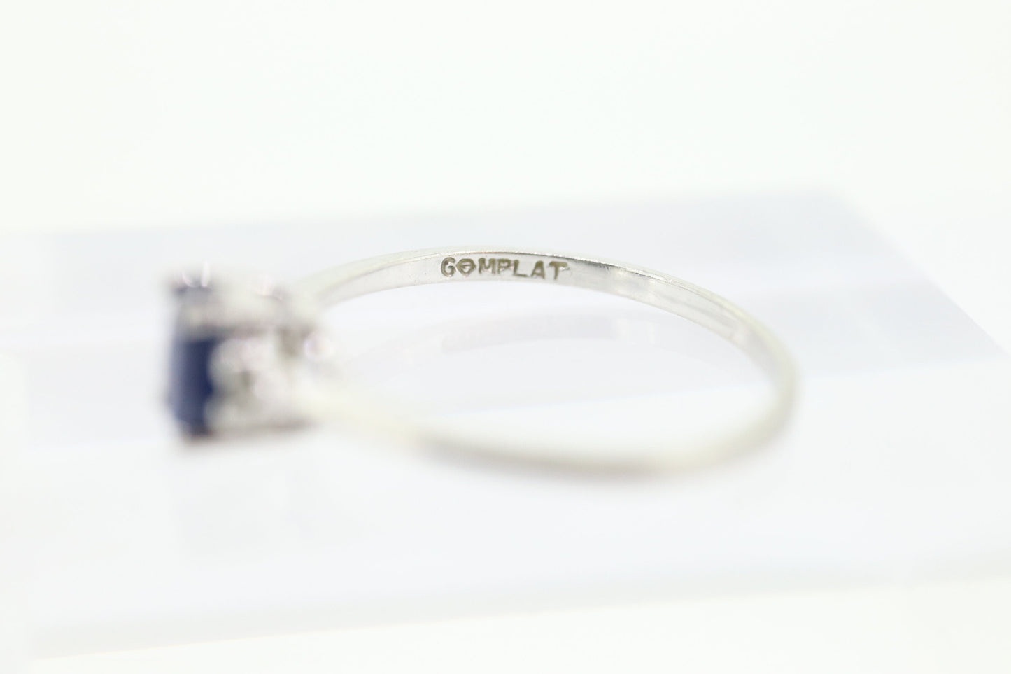 Platinum Sapphire and diamond ring. Oval blue Sapphire solitaire with Diamond accents trilogy ring.