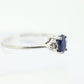 Platinum Sapphire and diamond ring. Oval blue Sapphire solitaire with Diamond accents trilogy ring.