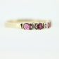 10k Anniversary Ruby Ring. A 10k gold ring with round Ruby and diamond accents eternity band. st(72)