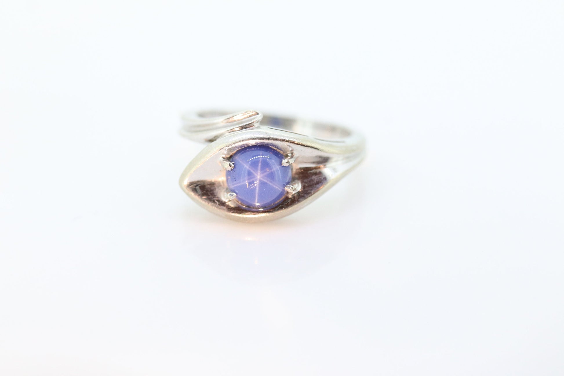 Linde Blue STAR Sapphire Solitaire  ring. 10k White gold sapphire solitaire. Blue Star Sapphire bypass ring. st(97/75