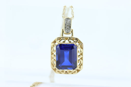 Blue emerald Sapphire and diamond 10k pendant. 10k twisted rope necklace