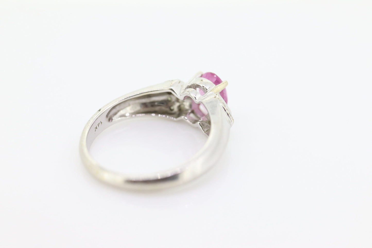 Oval Pink Sapphire Solitaire. 14k white gold with diamond melees st195