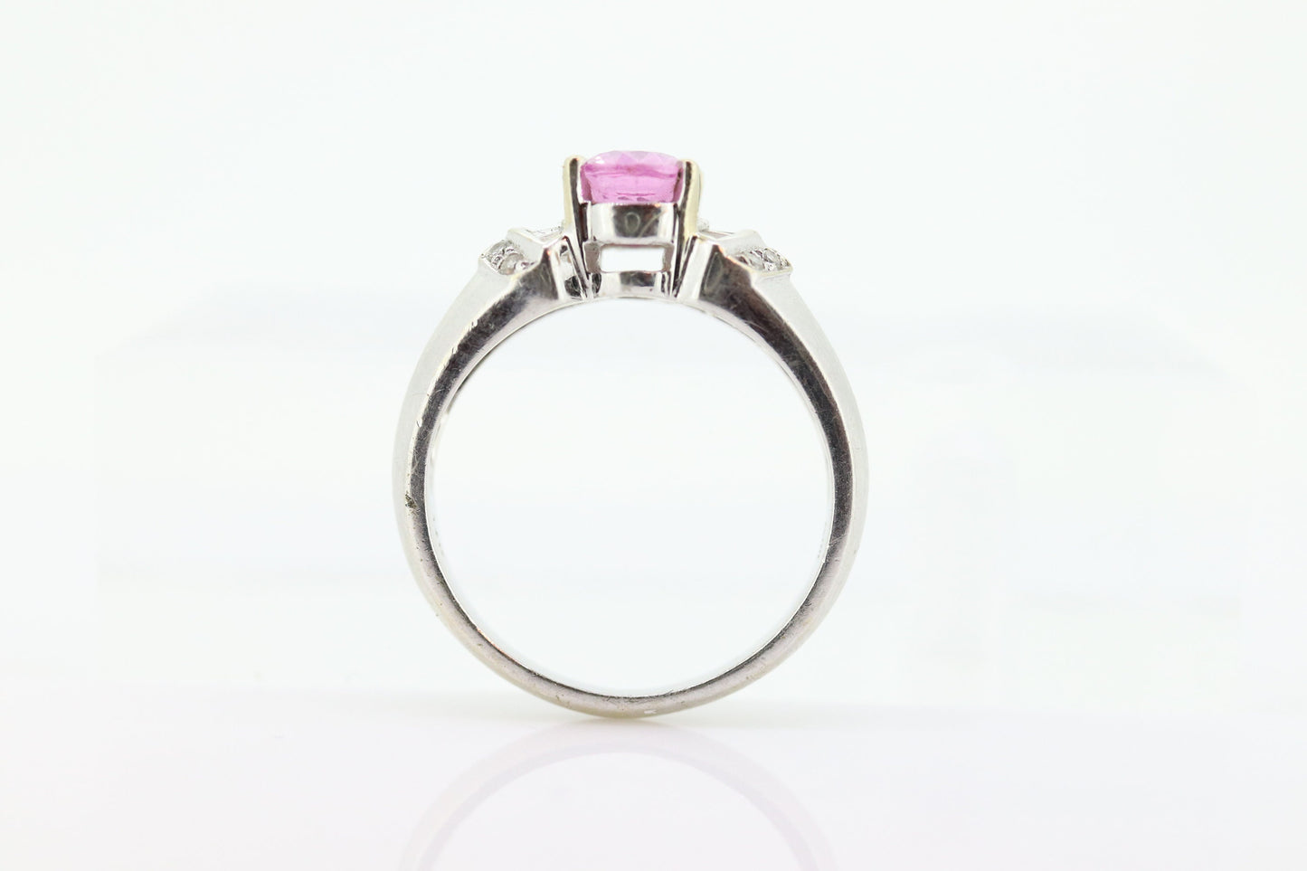 Oval Pink Sapphire Solitaire. 14k white gold with diamond melees st195