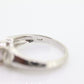 Oval Pink Sapphire Solitaire. 14k white gold with diamond melees st195