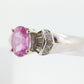 Oval Pink Sapphire Solitaire. 14k white gold with diamond melees st195
