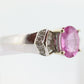 Oval Pink Sapphire Solitaire. 14k white gold with diamond melees st195