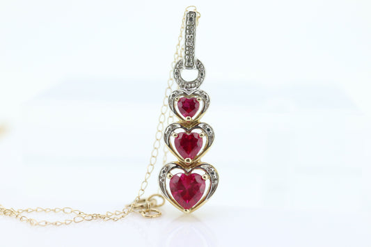 10k Ruby Faceted Heart with Diamond Necklace. 10k THL chain necklace and Pendant. st(78)