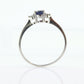 Platinum Sapphire and diamond ring. Oval blue Sapphire solitaire with Diamond accents trilogy ring.