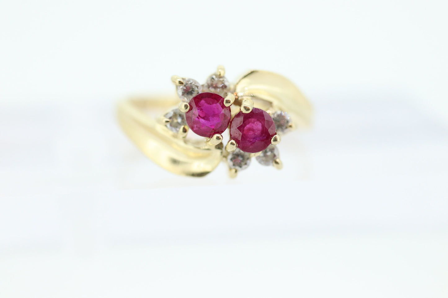 14k Ruby and Diamond Halo Ring. 14k Daisy Twin Double Ruby and Diamond Bypass ring.