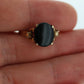 10k ONYX ring. Oval Onyx prong set victorian mourning ring. Scroll work shoulders. (st32/20)