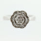 Diamond Daisy Cluster Elevated Ring. 10k White gold with round baguette diamond flower arrangement. st(52/90)