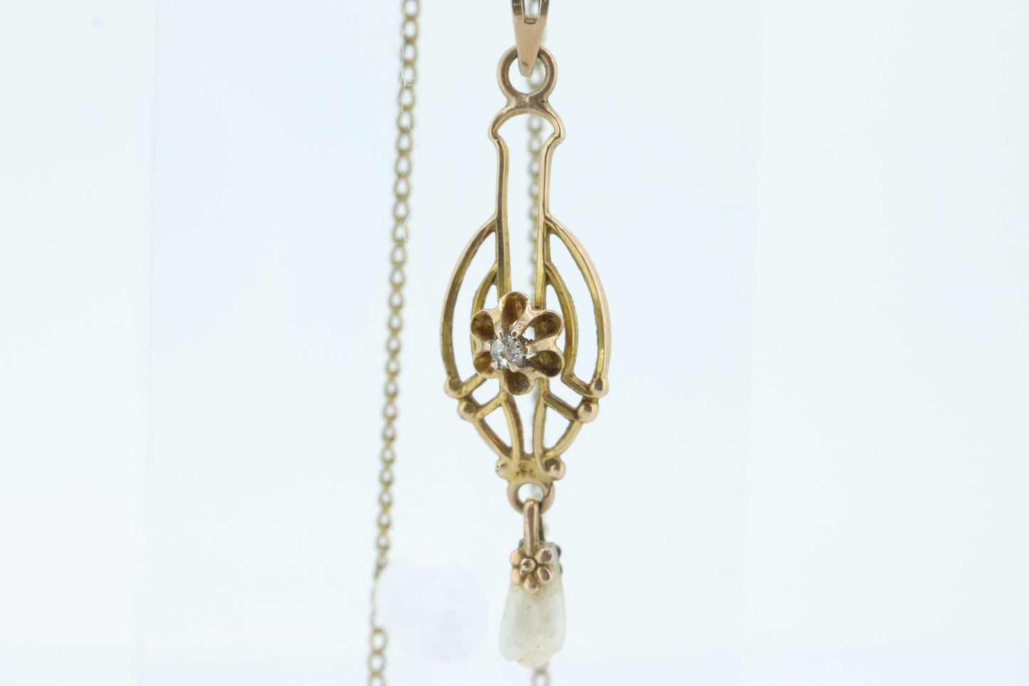 Otsby Barton Diamond pendant lavaliere. 10k Gold with a diamond set buttercup with rice pearl pendant for necklace. Otsby Barton (st80)