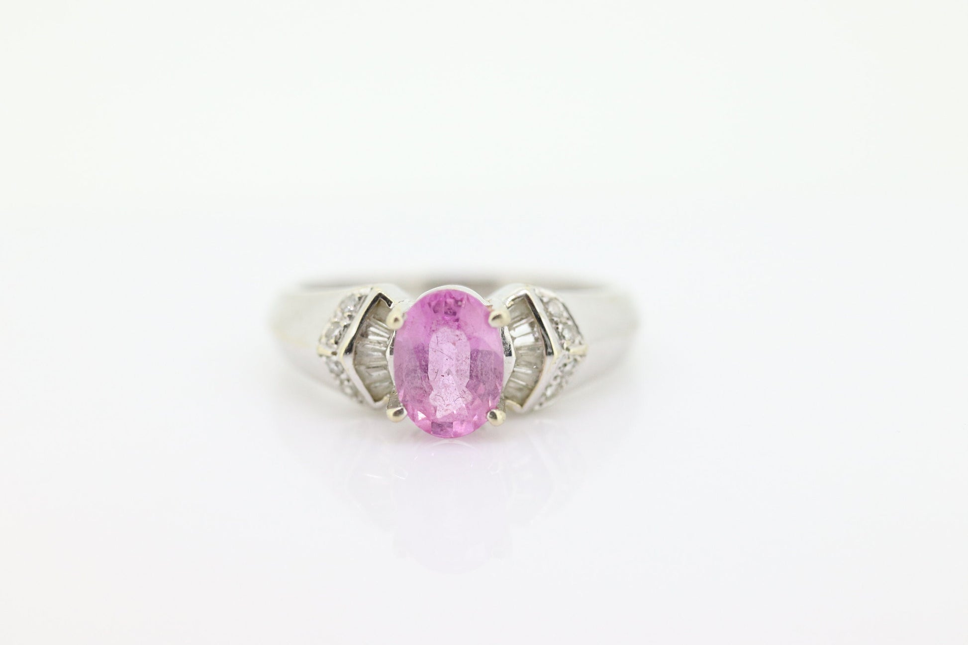 Oval Pink Sapphire Solitaire. 14k white gold with diamond melees st195