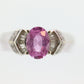 Oval Pink Sapphire Solitaire. 14k white gold with diamond melees st195