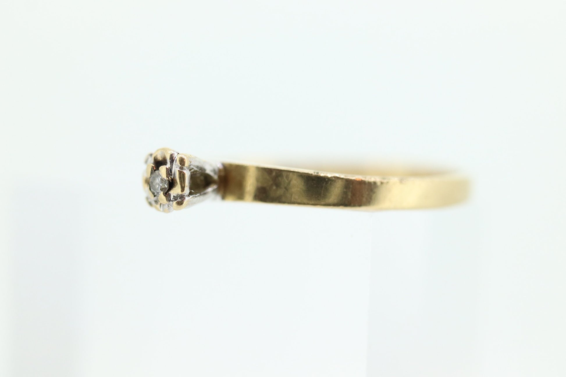 14k Diamond Solitaire. 14k Yellow gold engraved illusion set Daisy diamond ring.