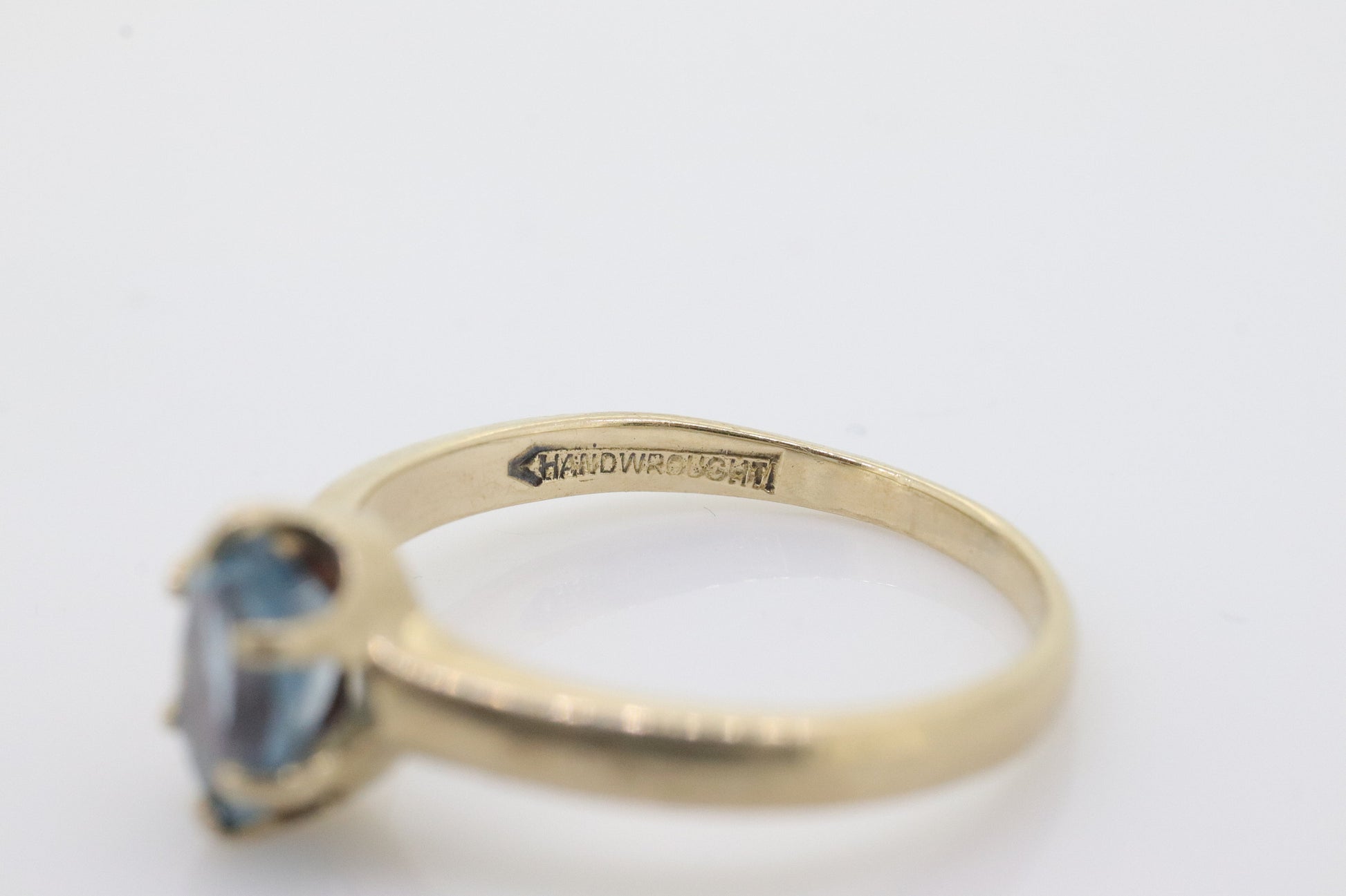 10k Topaz Solitaire Ring. 10k yellow gold HANDWROUGHT Blue Oval Topaz solitaire ring. st(42)