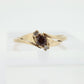 10k Garnet and diamond ring. 10k Round cut garnet with diamonds solitaire. st(62)