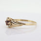 10k Garnet and diamond ring. 10k Round cut garnet with diamonds solitaire. st(62)