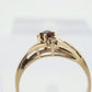 10k Garnet and diamond ring. 10k Round cut garnet with diamonds solitaire. st(62)