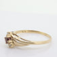 10k Garnet and diamond ring. 10k Round cut garnet with diamonds solitaire. st(62)