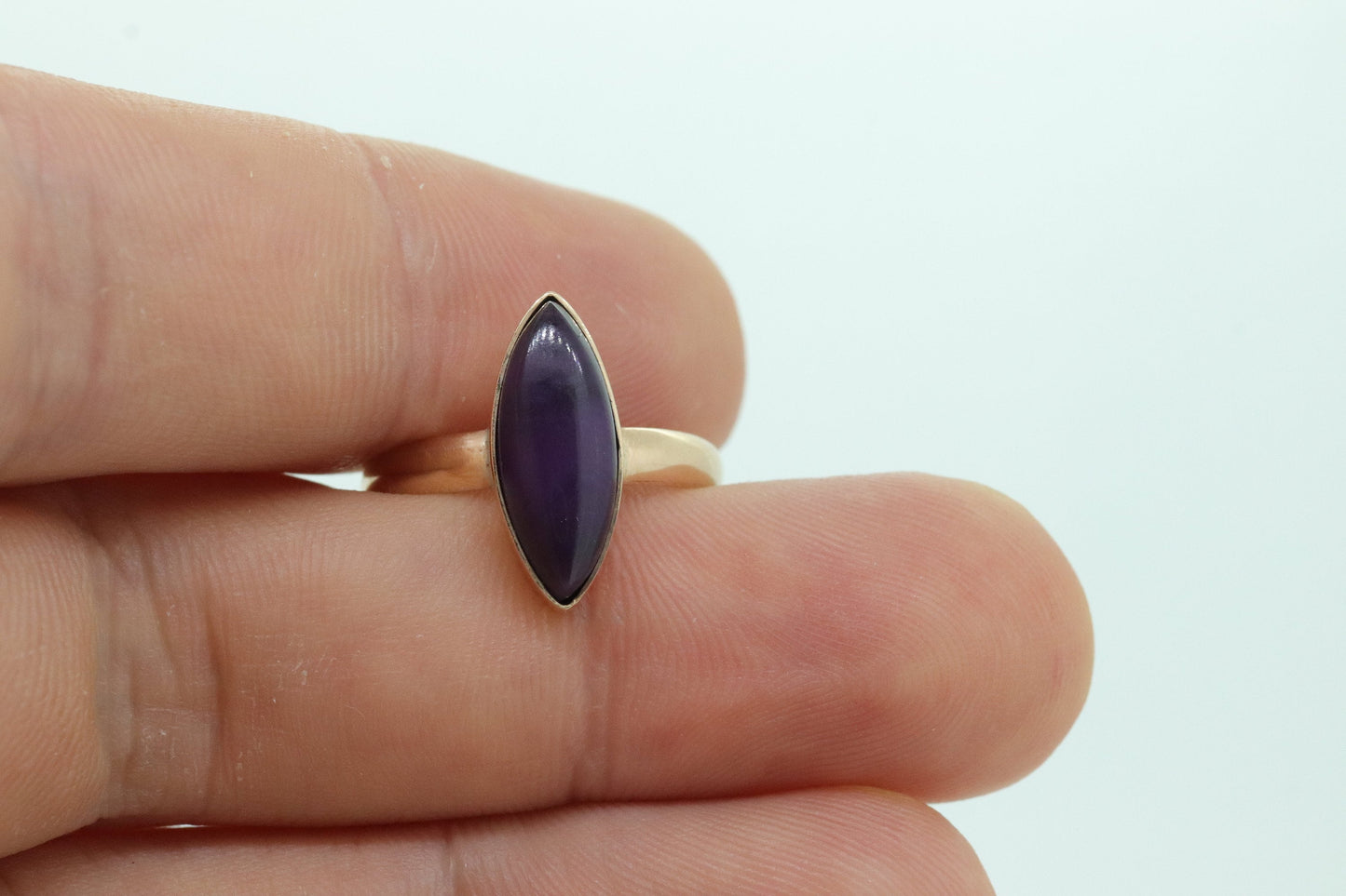 10k SUGILITE Purple bezel ring. Antique 10k Marquise Purple Sugilite bezel set in a cup shank. st(80)