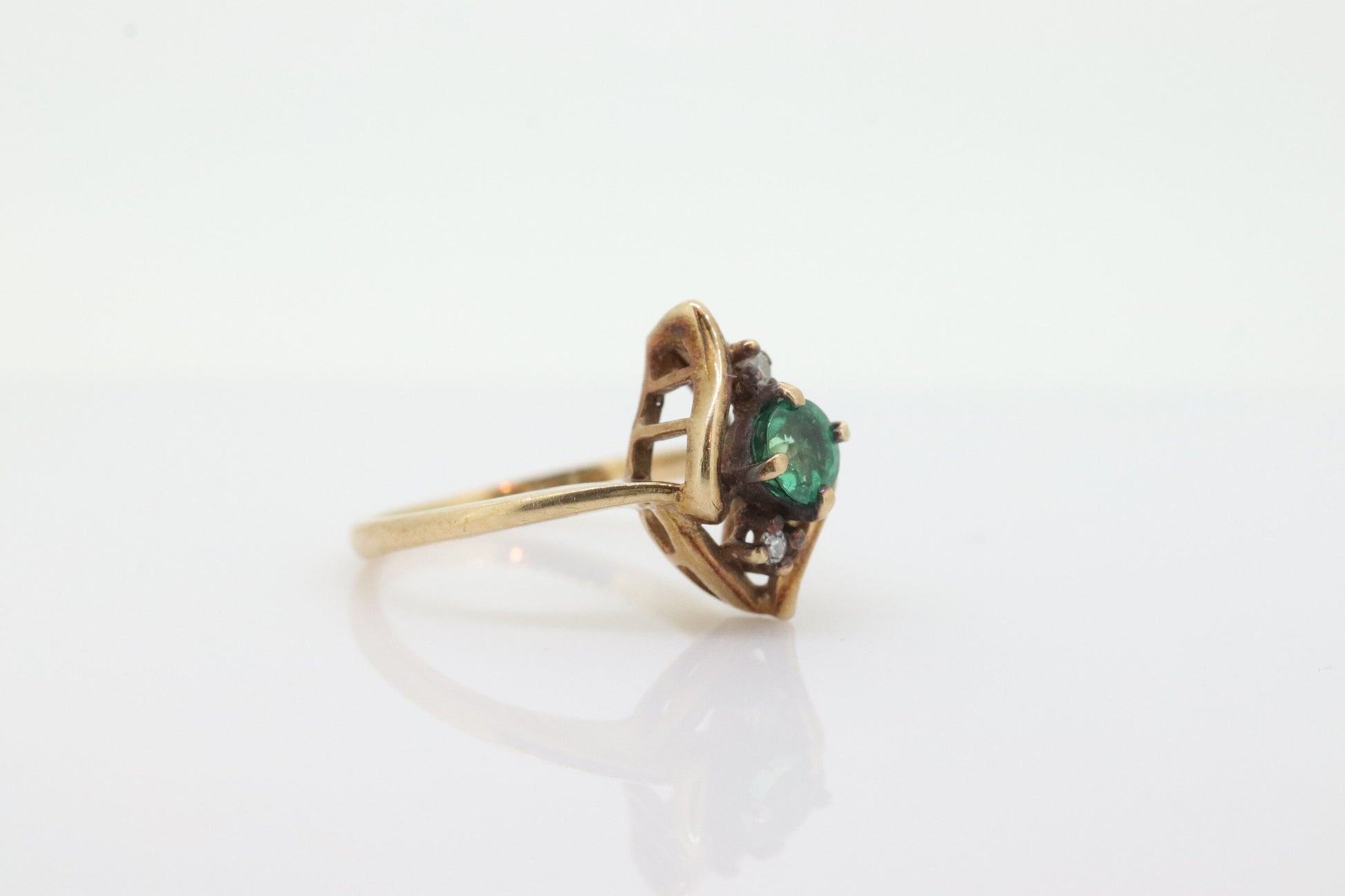 14k round Emerald and diamond ring. 14k Yellow gold marquise shape with diamond accents. st(55)