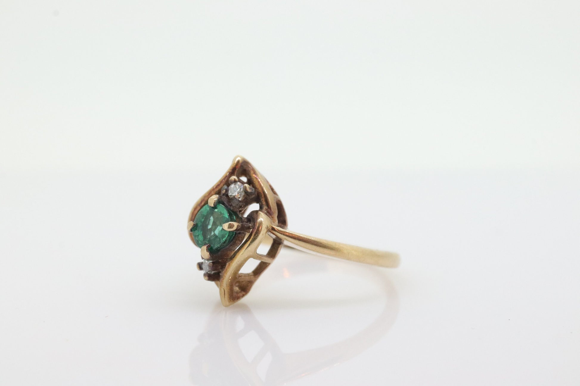 14k round Emerald and diamond ring. 14k Yellow gold marquise shape with diamond accents. st(55)