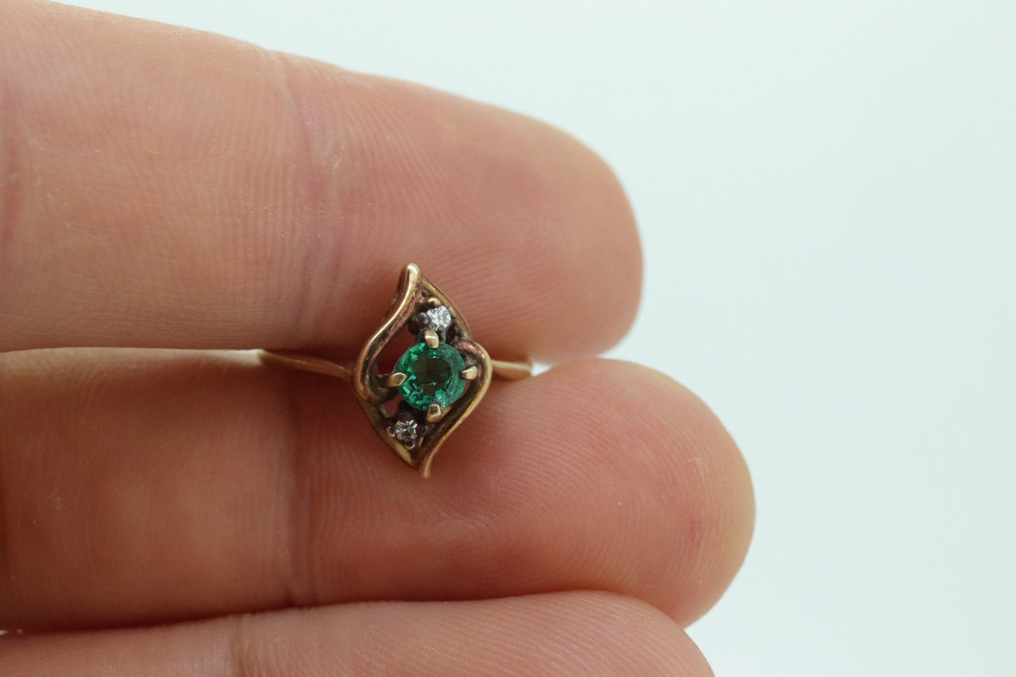 14k round Emerald and diamond ring. 14k Yellow gold marquise shape with diamond accents. st(55)