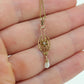 Otsby Barton Diamond pendant lavaliere. 10k Gold with a diamond set buttercup with rice pearl pendant for necklace. Otsby Barton (st80)