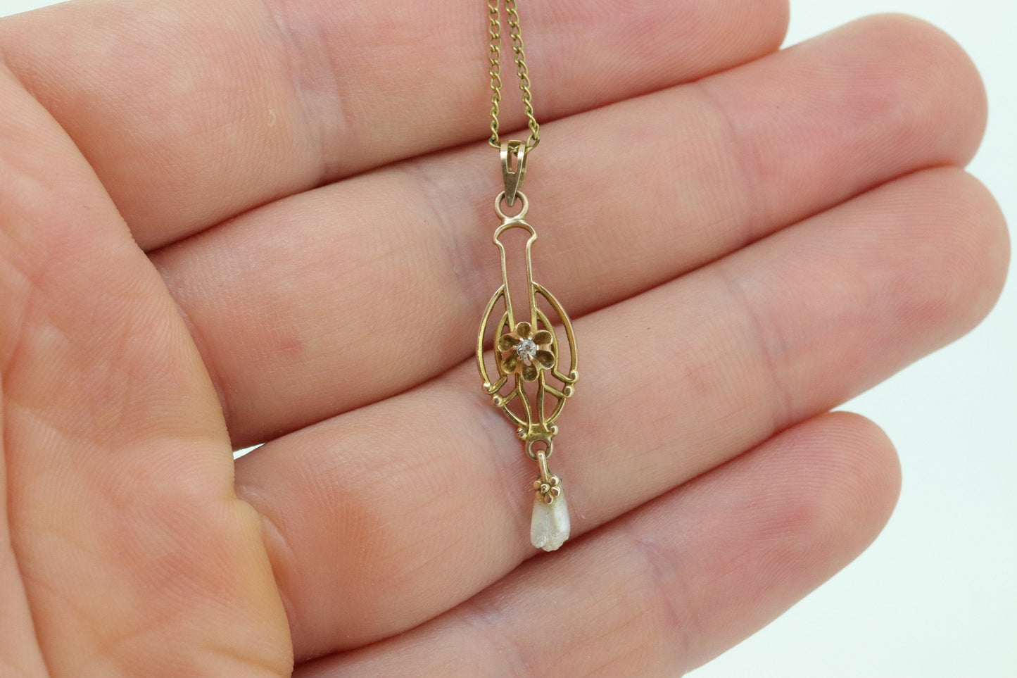 Otsby Barton Diamond pendant lavaliere. 10k Gold with a diamond set buttercup with rice pearl pendant for necklace. Otsby Barton (st80)