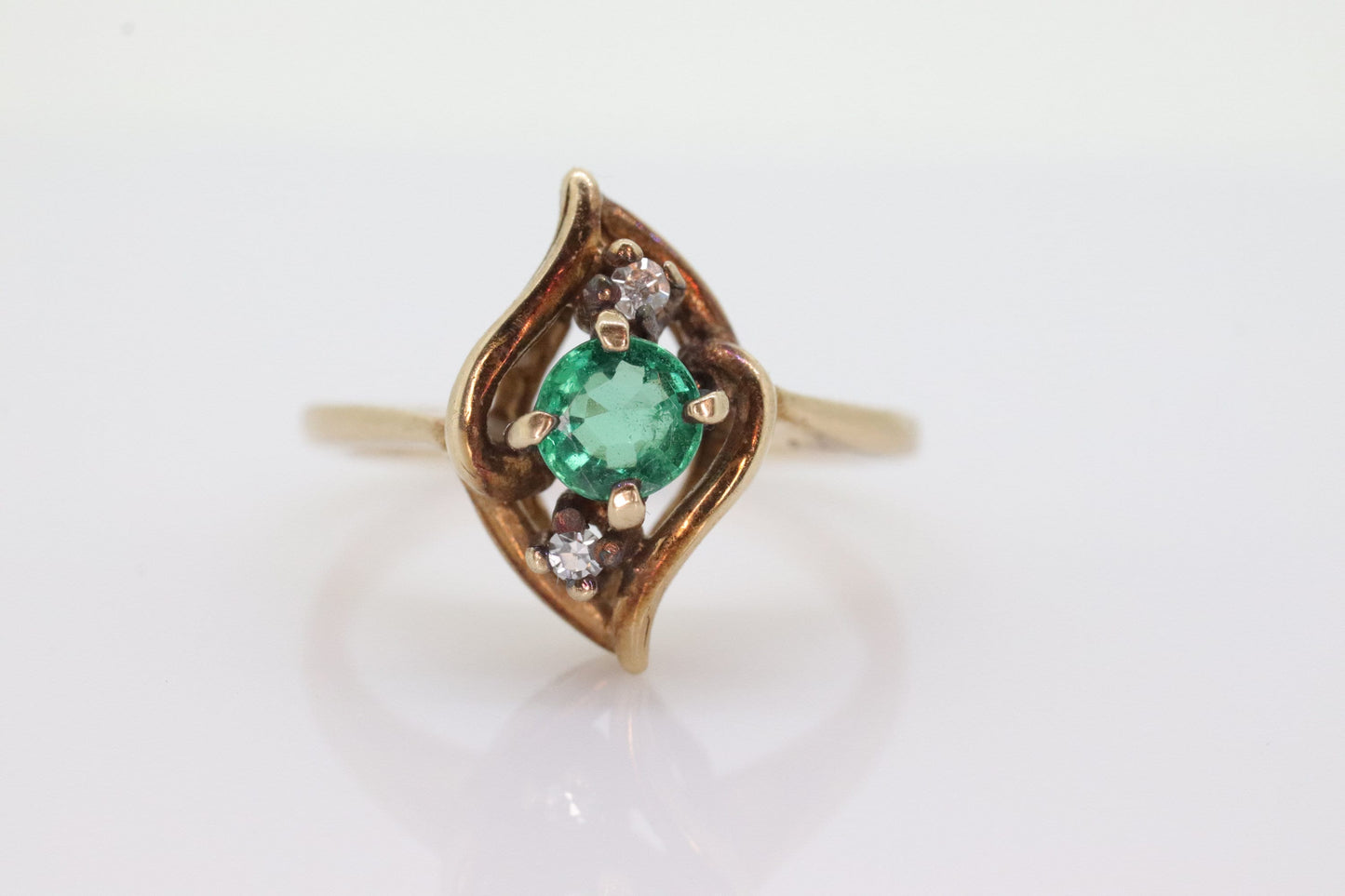 14k round Emerald and diamond ring. 14k Yellow gold marquise shape with diamond accents. st(55)