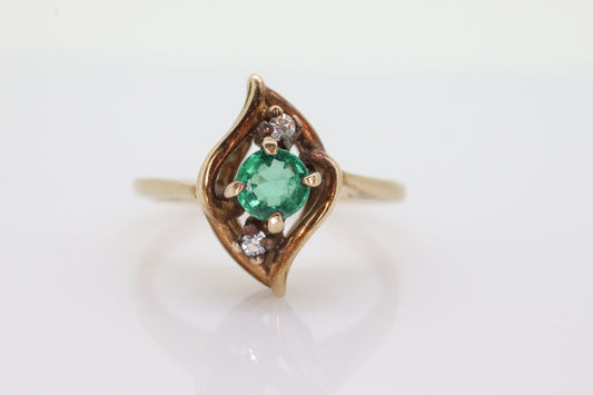 14k round Emerald and diamond ring. 14k Yellow gold marquise shape with diamond accents. st(55)