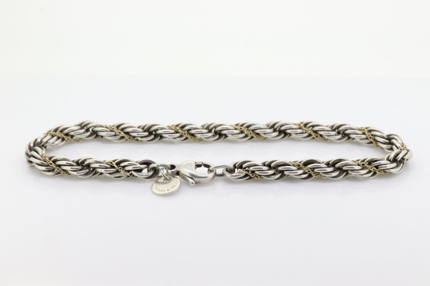 Tiffany & Co. Bracelet. Rope Love Knot Sterling Silver and 18k Yellow Gold Intertwined Bracelet. st(155)