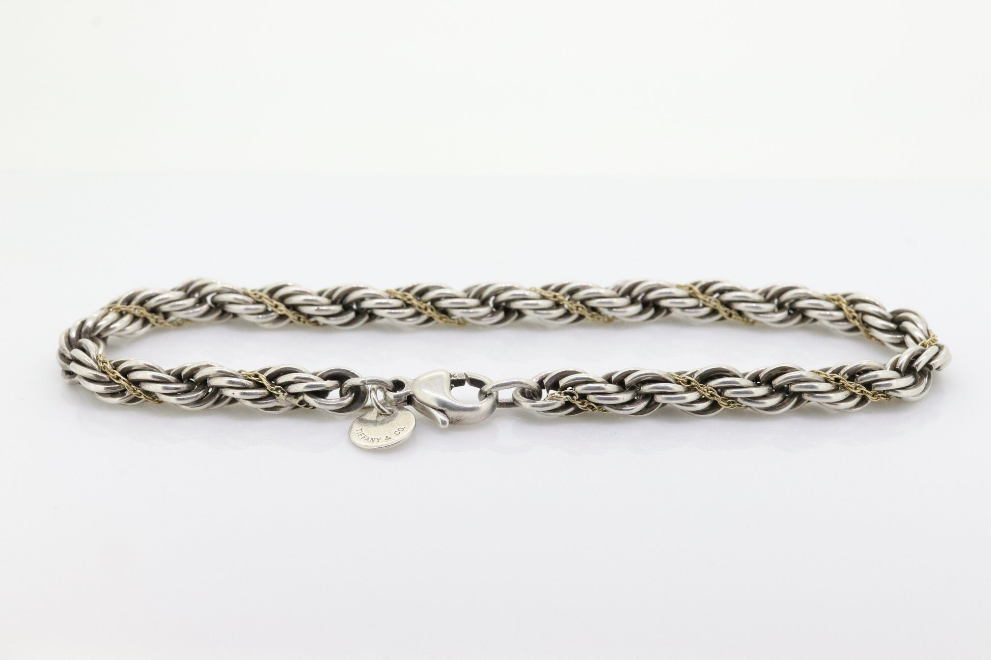 Tiffany & Co. Bracelet. Rope Love Knot Sterling Silver and 18k Yellow Gold Intertwined Bracelet. st(155)