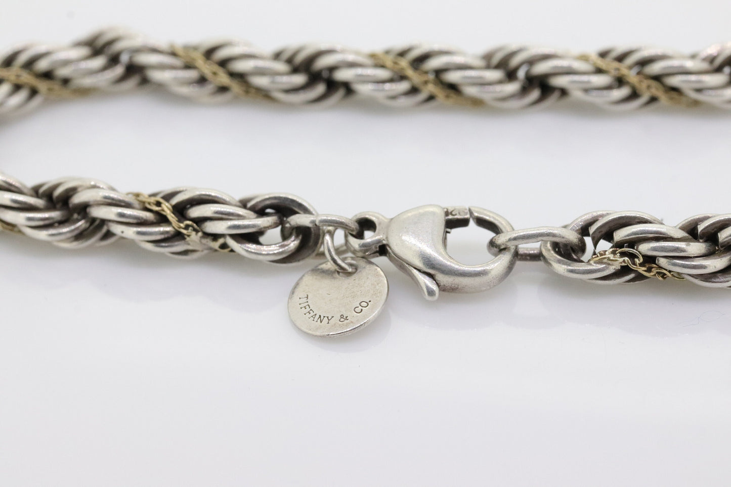 Tiffany & Co. Bracelet. Rope Love Knot Sterling Silver and 18k Yellow Gold Intertwined Bracelet. st(155)