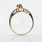 10k Garnet and diamond ring. 10k Round cut garnet with diamonds solitaire. st(62)