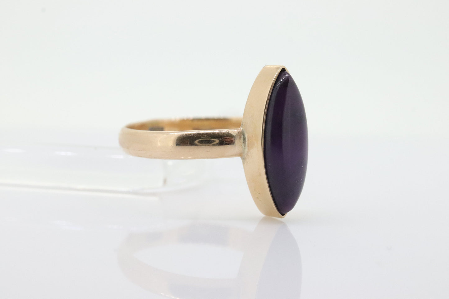 10k SUGILITE Purple bezel ring. Antique 10k Marquise Purple Sugilite bezel set in a cup shank. st(80)