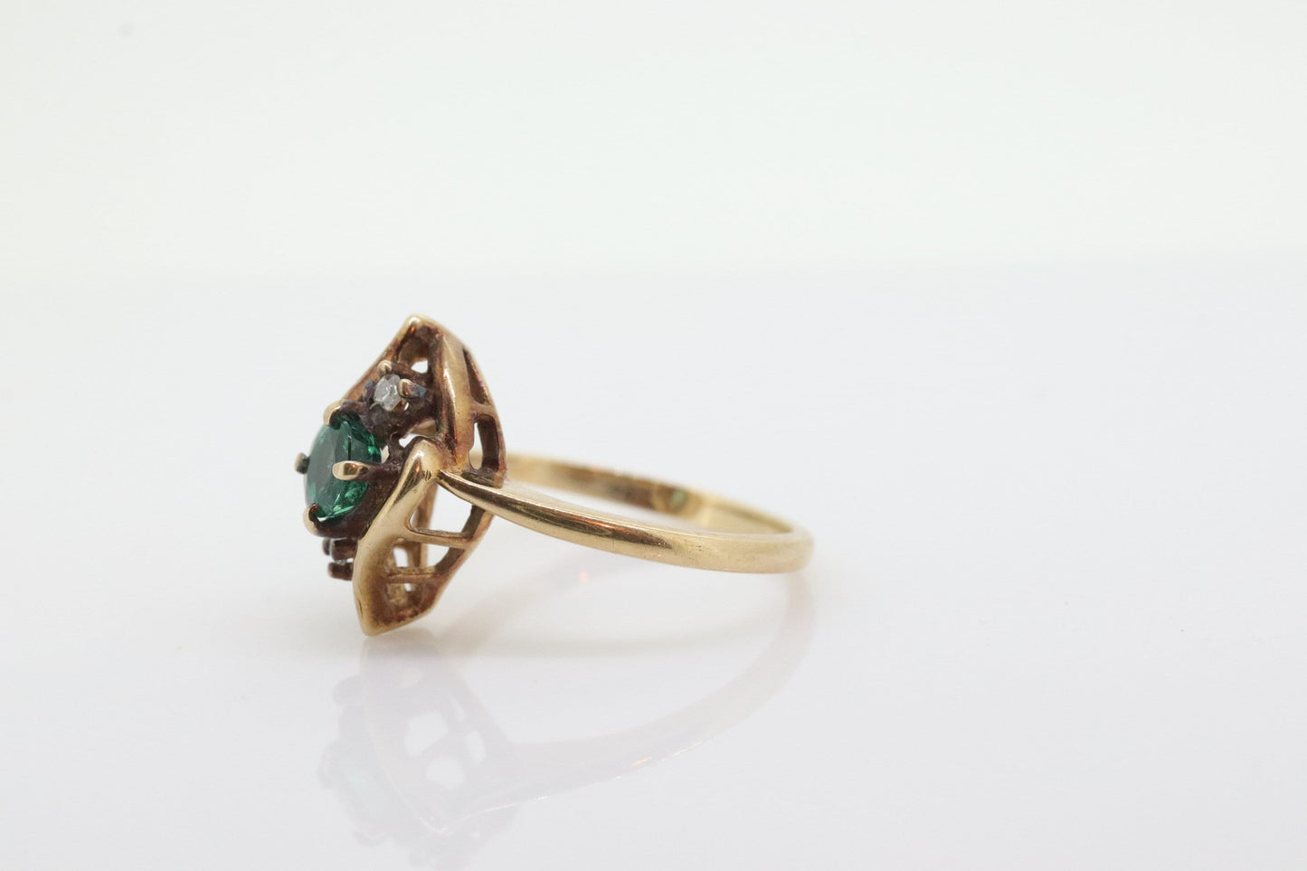 14k round Emerald and diamond ring. 14k Yellow gold marquise shape with diamond accents. st(55)