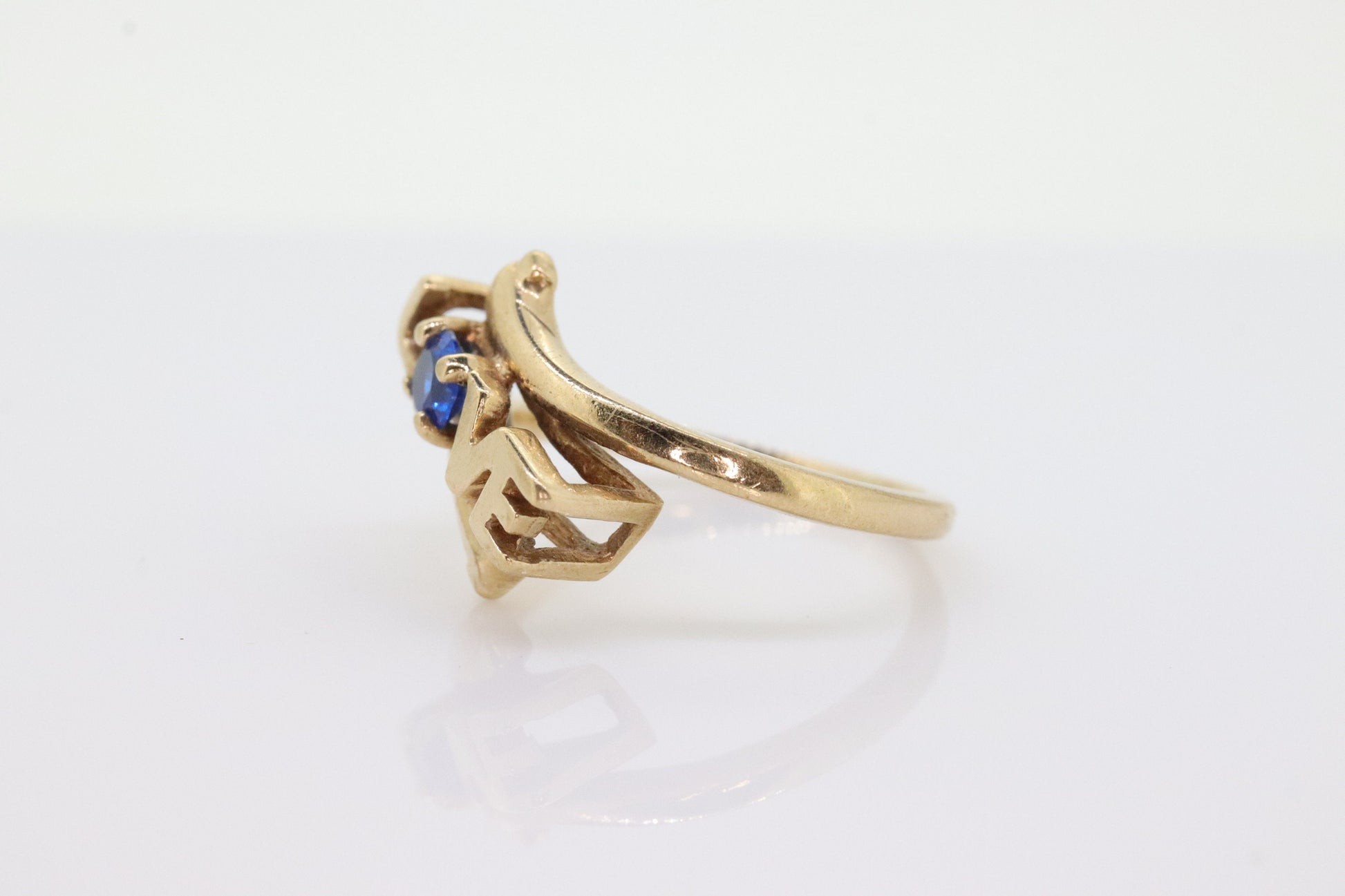 10k LOVE ring. 10k Yellow Gold with round Blue Spinel Solitaire Ring