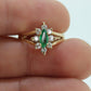 14k Marquise Emerald and Diamond Halo yellow gold ring. 0.36ctw in diamonds