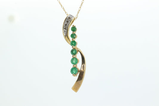 10k Gold 6 emerald Journey Pendant and necklace. Round Green Emerald Graduating Journey Pendant. St(75)