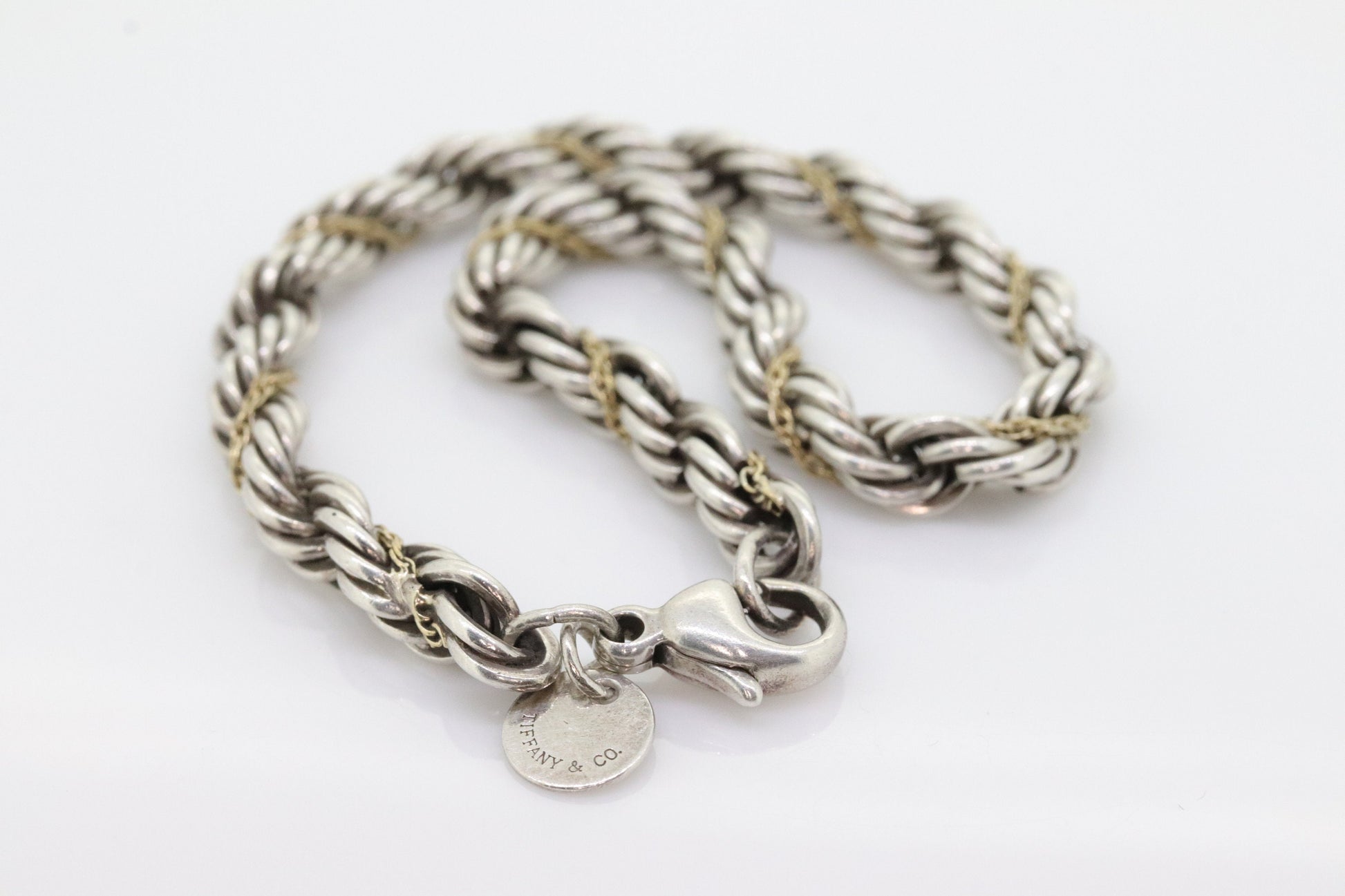 Tiffany & Co. Bracelet. Rope Love Knot Sterling Silver and 18k Yellow Gold Intertwined Bracelet. st(155)