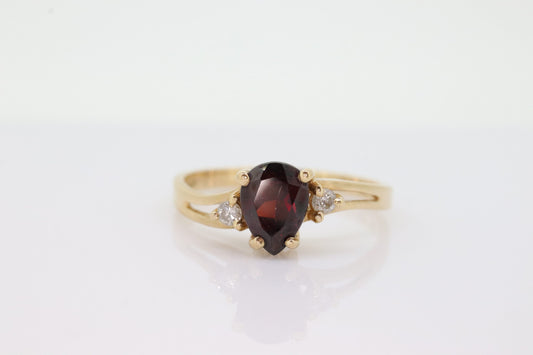 14k Pear Garnet and diamond ring. 14k Pear cut garnet with diamonds solitaire